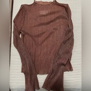 Long sleeve, sheer, mock neck metallic top.